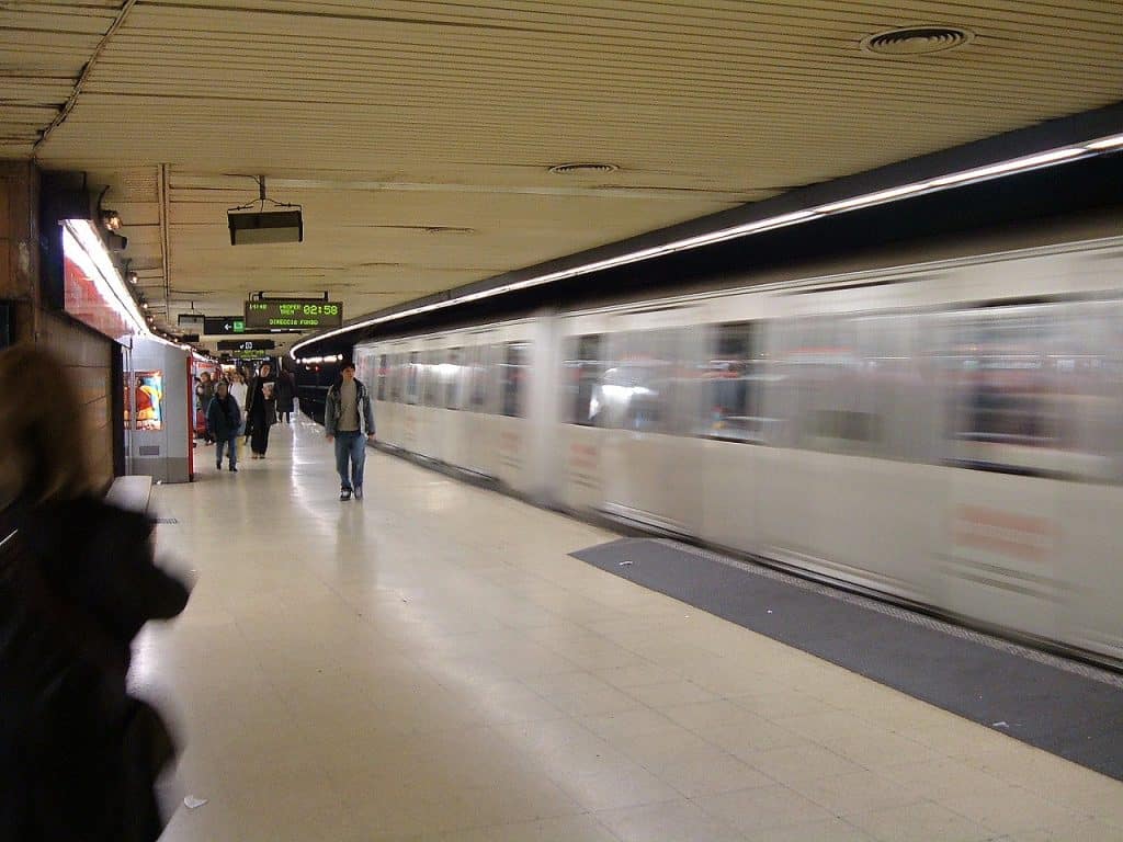 Metro train passing through Plaça de Catalunya station (L1), Barcelona transport advertising agency
