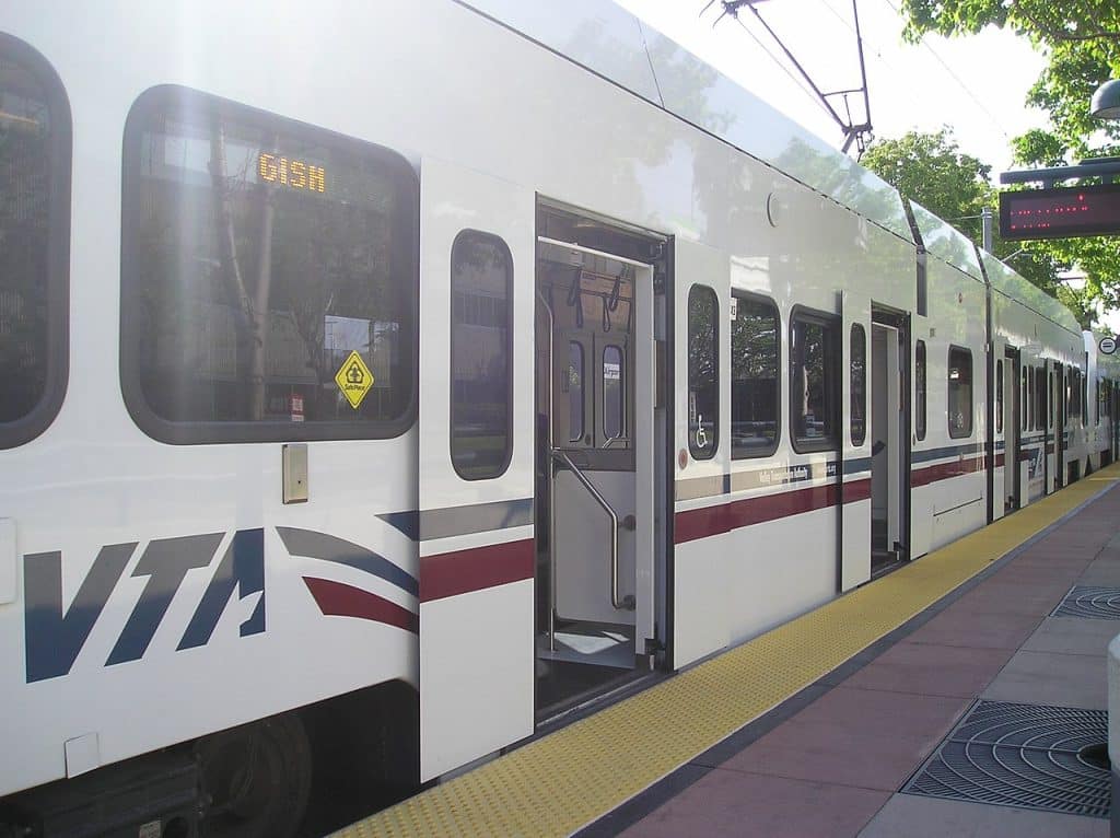 Low-floor VTA Light Rail car waiting at a station, San Jose advertising agency