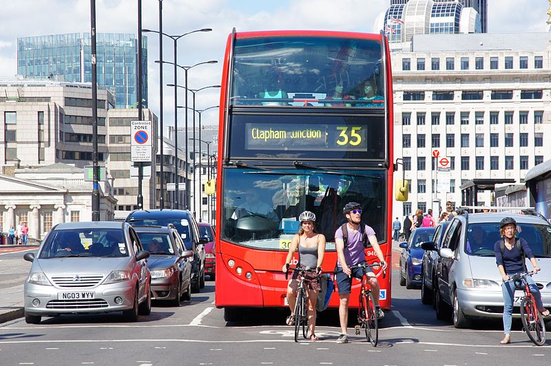 Double-decker bus waiting on London Bridge signal, London advertising agency