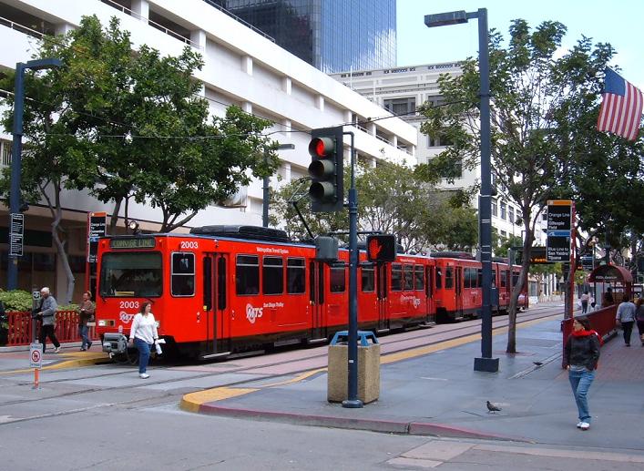Trolley carrying commuters in Downtown San Diego, San Diego advertising agency
