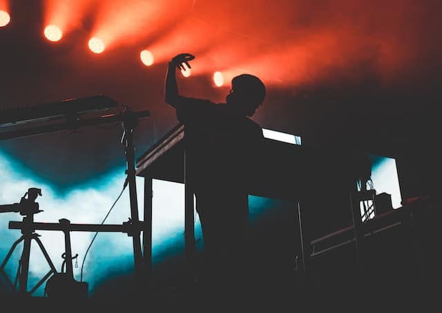 A musician playing electronic music at festival, San Jose advertising agency