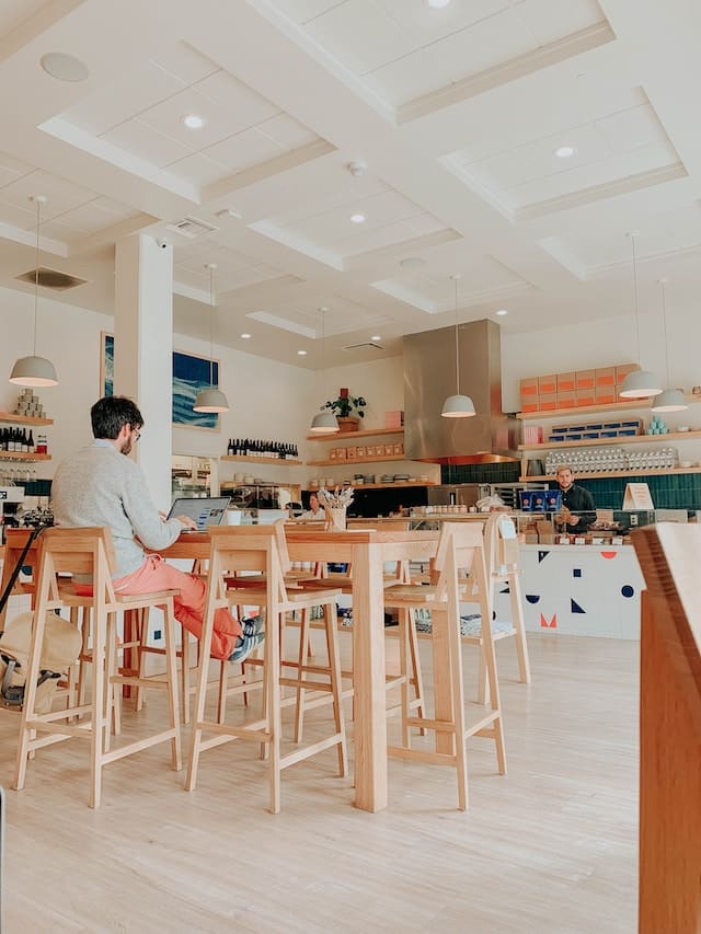 A person sitting on a chair in a local restaurant, San Jose advertising agency