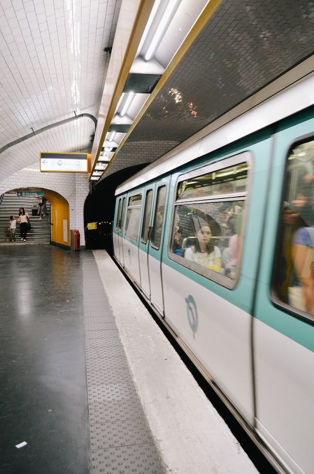 Subway train carrying passengers to their destination, Paris transport advertising agency