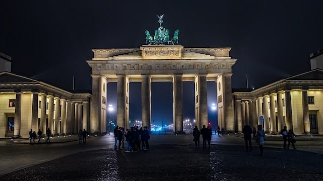 Front view of Brandenburg Gate during night, Berlin advertising agency