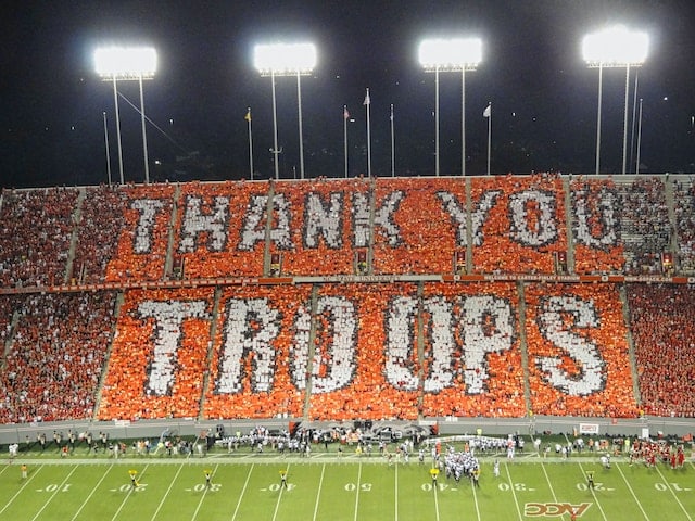 Fans at Carter Finley Stadium paying tribute to troops, Raleigh sports advertising agency
