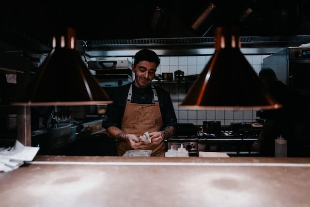 A chef preparing food at restaurant in Berlin, Berlin advertising agency