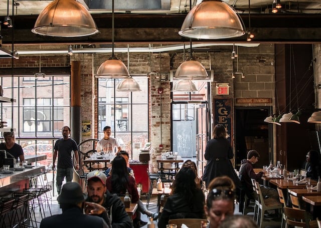 People sitting in a restaurant in Toronto advertising agency