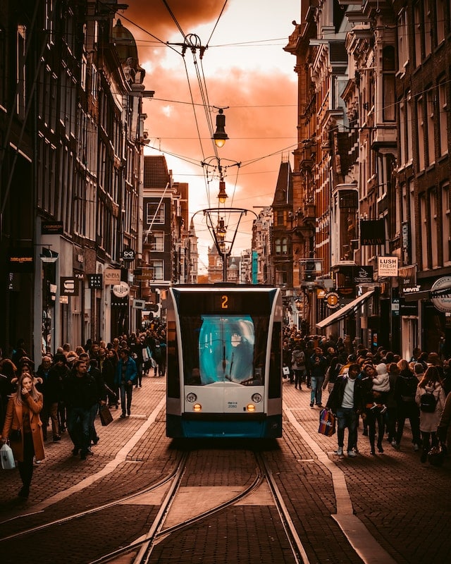 A train passing through the street of Amsterdam real estate advertising agency