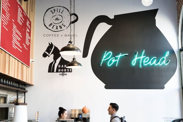 A customer asking for food to waiter in a restaurant, San Diego advertising agency