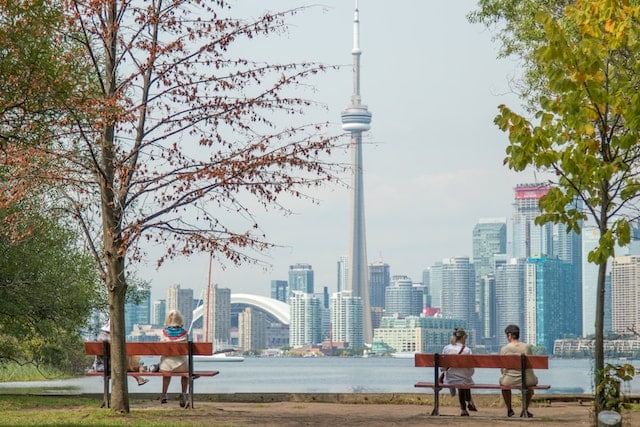 3 ladies enjoying the view of CN Tower, Toronto advertising agency