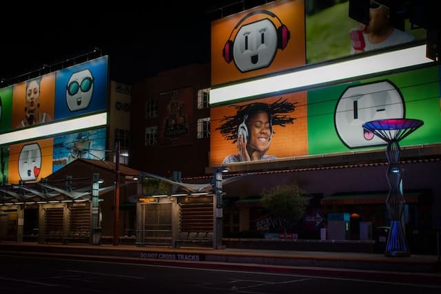 A billboard showing children and emojis, Phoenix advertising agency