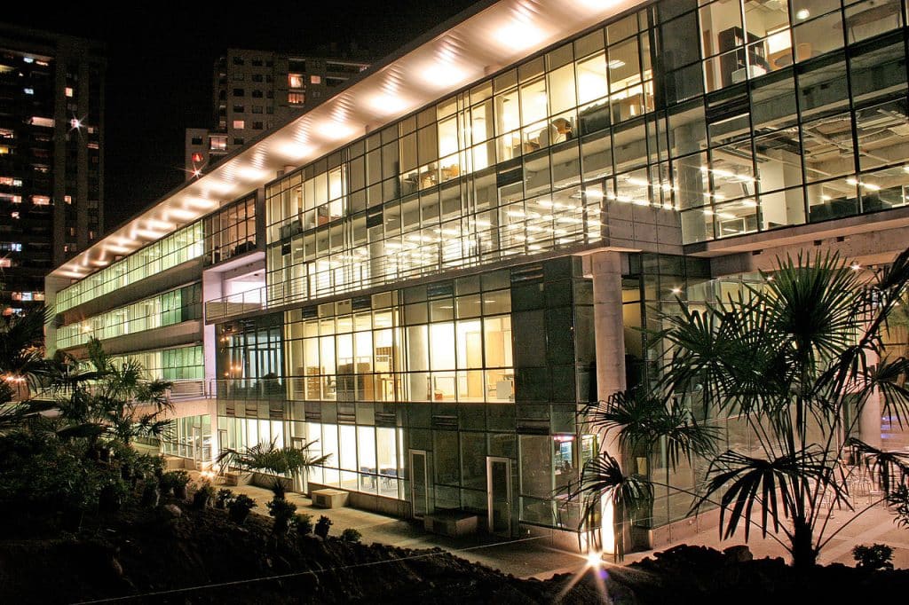 Beautiful view of Faculty of Economics and Business Tecnoaulas Building at night, Santiago advertising agency.