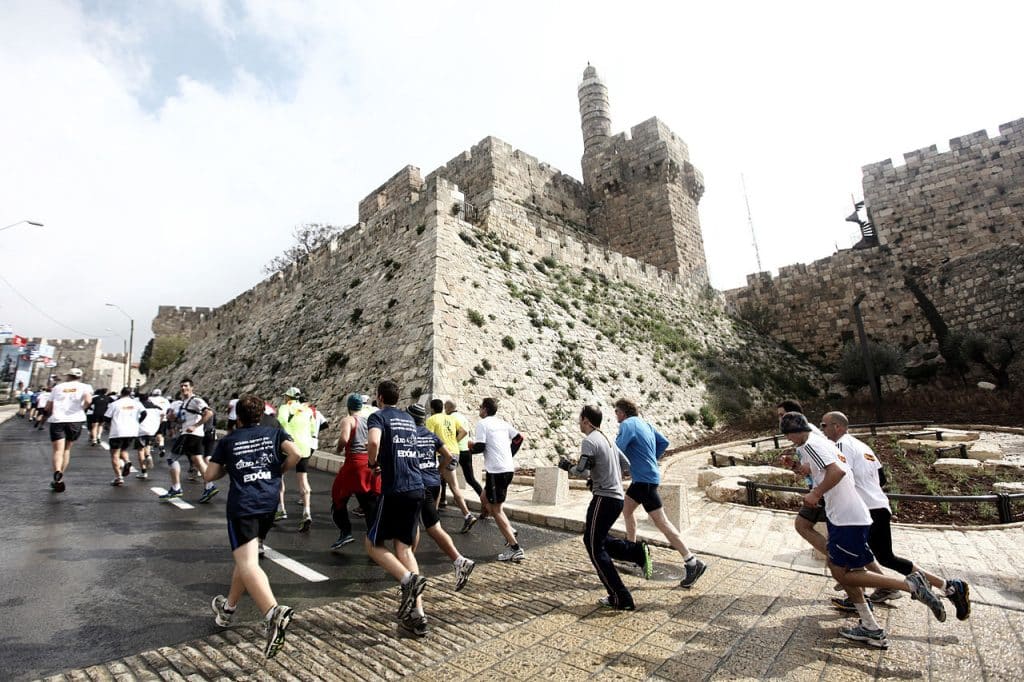 People running during Jerusalem Marathon, Jerusalem advertising agency. 
