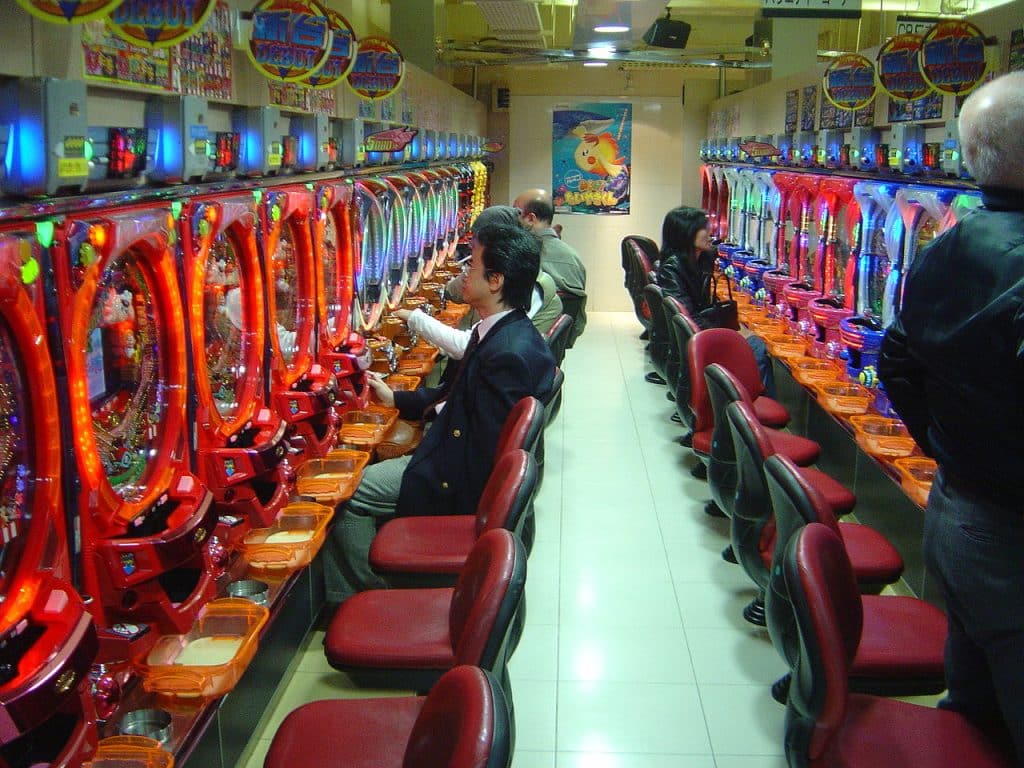 A man sitting infront of parlor, Gambling Advertising Agency.