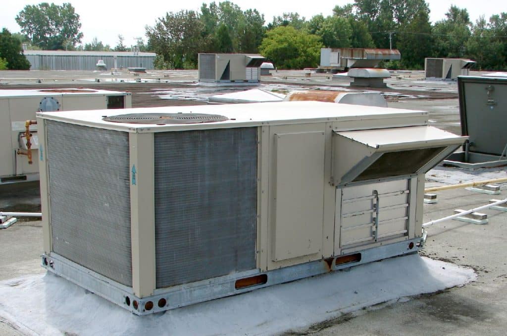 HVAC unit at rooftop with fresh-air intake vent, HVAC Advertising Agency.