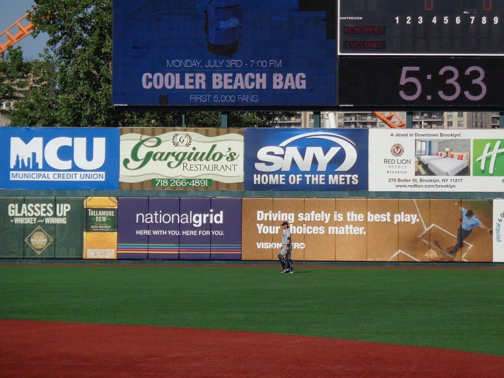 Advertising boards at stadium during a match, Sports Advertising Agency.