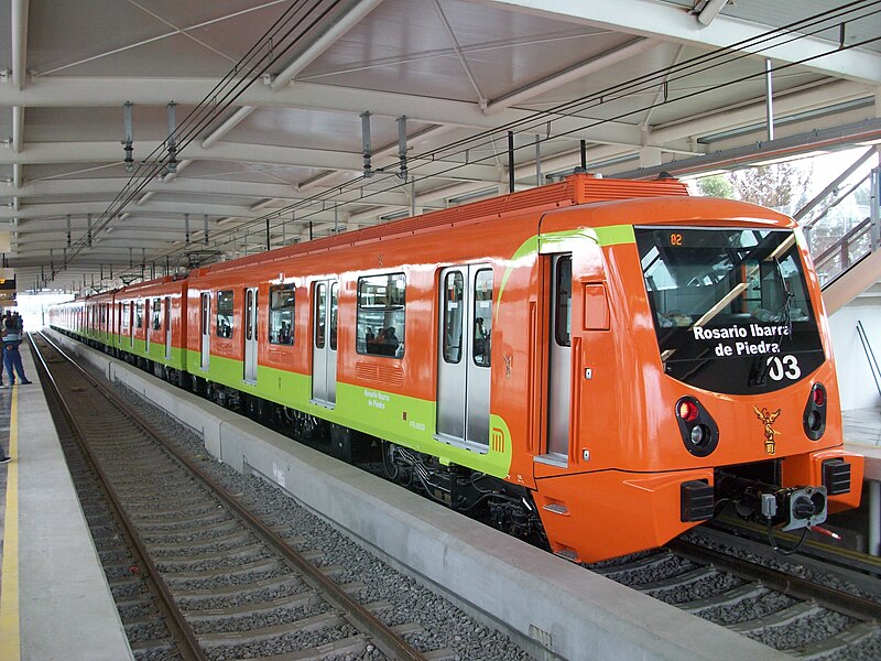 City Metro train waiting for commuters at terminal, Mexico transport advertising agency.