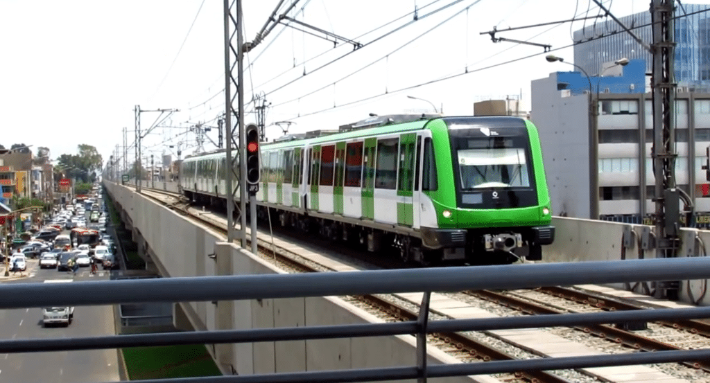 A metro train passing over the bridge in Lima advertising agency.