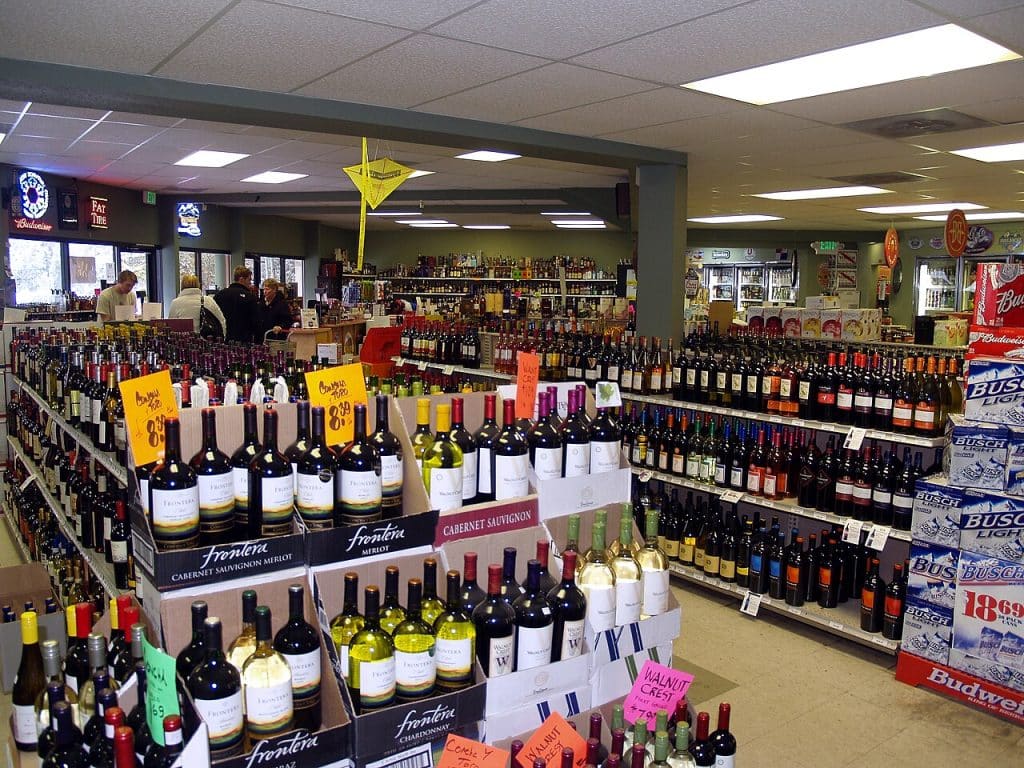 Liquor store with alot of liquor brands at display, Liquor Store Advertising.