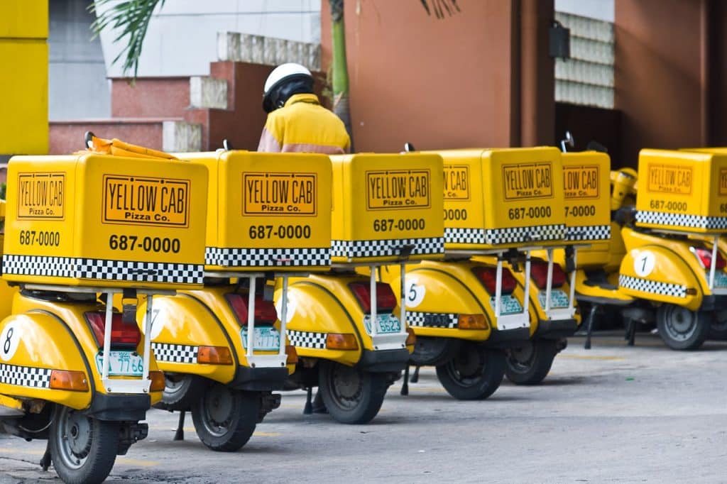 Pizza delivery scooters ready to deliver pizzas to customers, Delivery Advertising Agency.