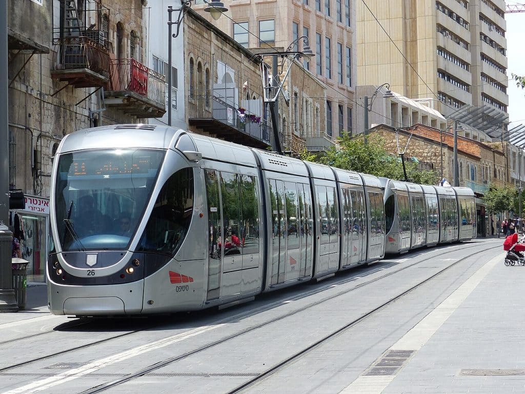 Light metro train carrying passengers in Jerusalem city, Jerusalem advertising agency.