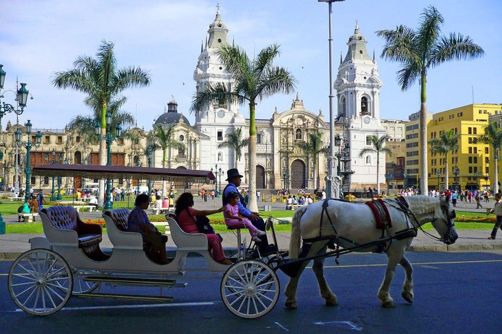 People at Plaza de Armas, Lima advertising agency.