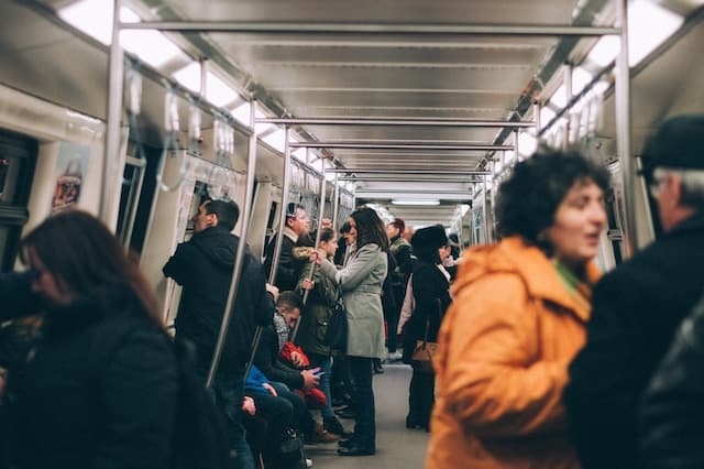Commuters in a subway train, Transportation Advertising Agency