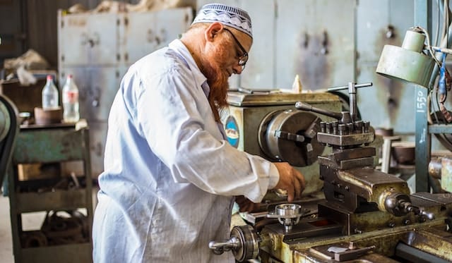 A locksmith working on making a lock, Locksmith Advertising Agency.