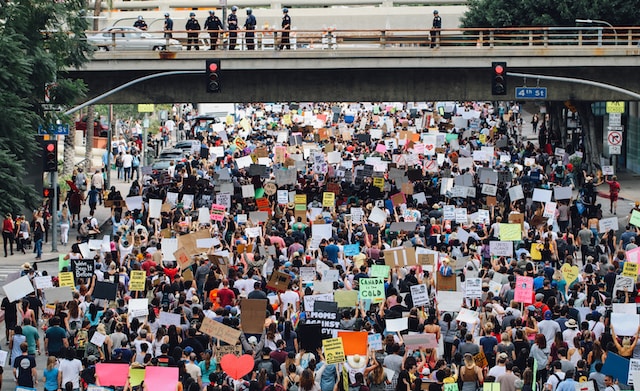 Political rally marching on roads, Political Advertising Agency.