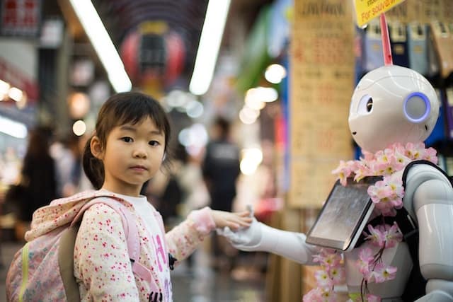 An AI robot shaking hand with a child, Technology Advertising Agency.