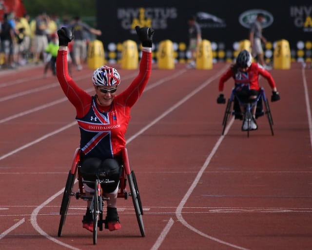 A player celebrating after winning race, Sports Advertising Agency.