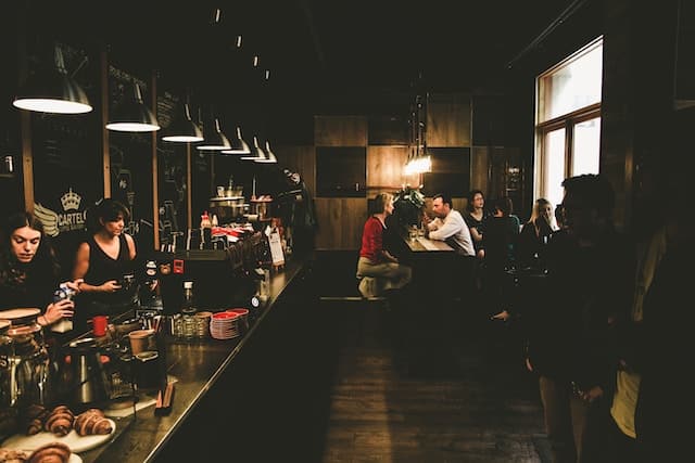 Customers drinking coffee in a restaurant, Melbourne advertising agency