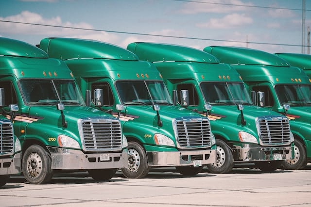 Trucks ready to transport cargo, Transportation Advertising Agency.
