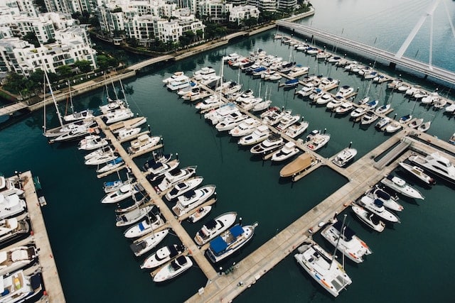 Yachts and boats on harbor, Yacht & Boat Advertising Agency.