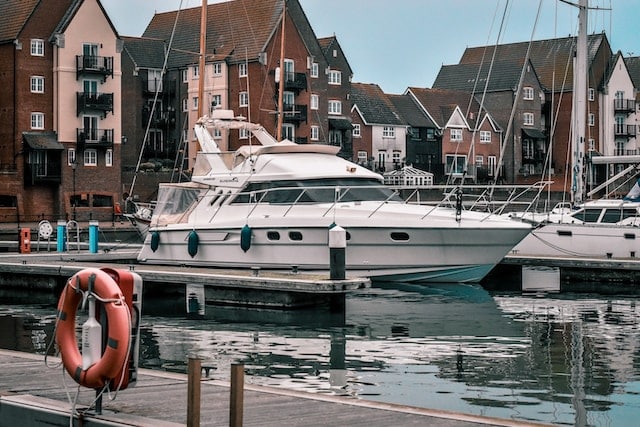 A couple small yachts parked at harbor, Yacht & Boat Advertising Agency.