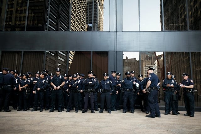 Policemen standing infront of a building, Law Enforcement Advertising.