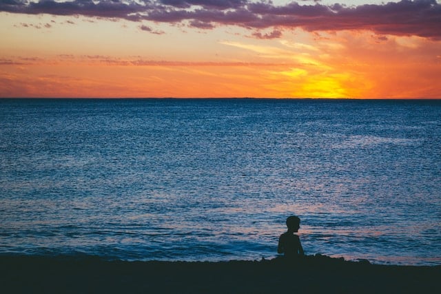A person enjoying at Cottesloe during sunset, Perth advertising agency