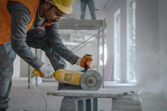 Worker performing his task during constrution, Restoration Advertising Agency.