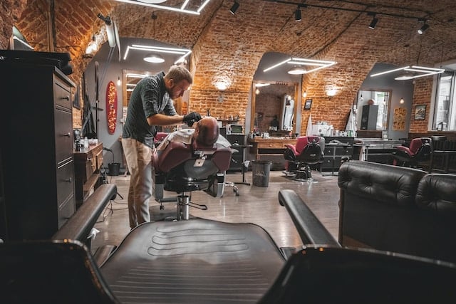 Customer hair cutting at hair salon, Hair Salon Advertising Agency.