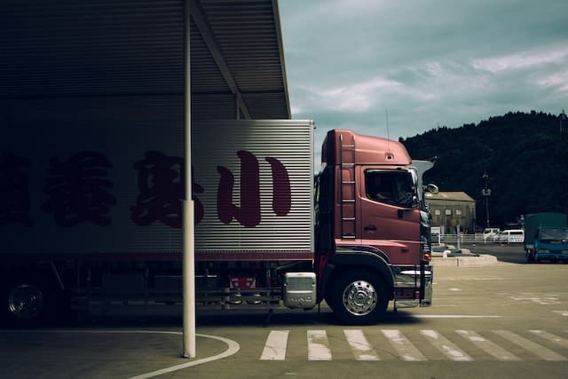 A cargo truck in a parking area, Movers Advertising Agency.