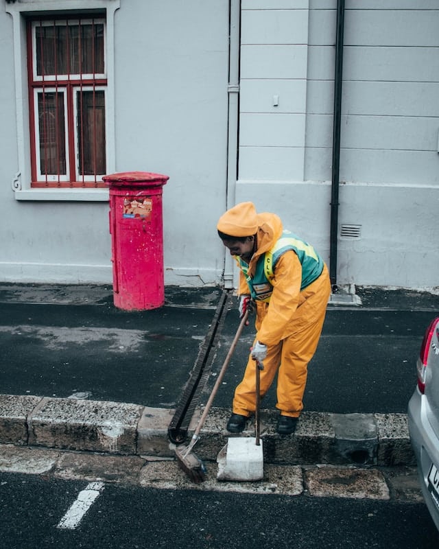 A cleaner cleaning a street, Janitorial Advertising Agency.
