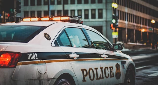 Police car on a road, Law Enforcement Advertising.