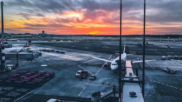 Airport with a sunset in a background. Airline Advertising Agency