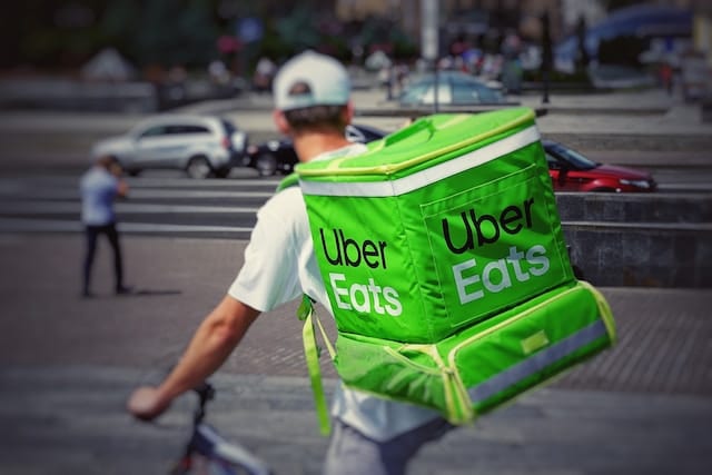 Delivery man with a food parcel, Delivery Advertising Agency.