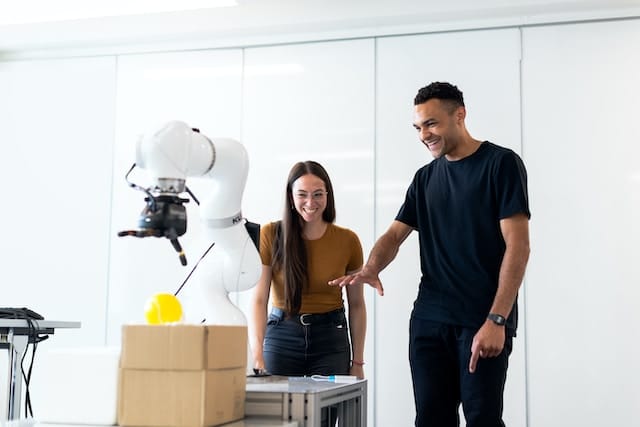 Engineers observing a medical robots, Technology Advertising Agency.