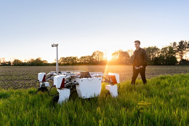 A robot working on agricultural field, Technology Advertising Agency.