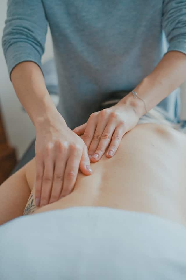 A Chiropractor treating a patient, Chiropractor Advertising Agency .
