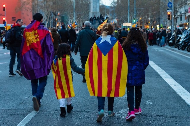 Political workers with catalan flag at their back, Political Advertising Agency.