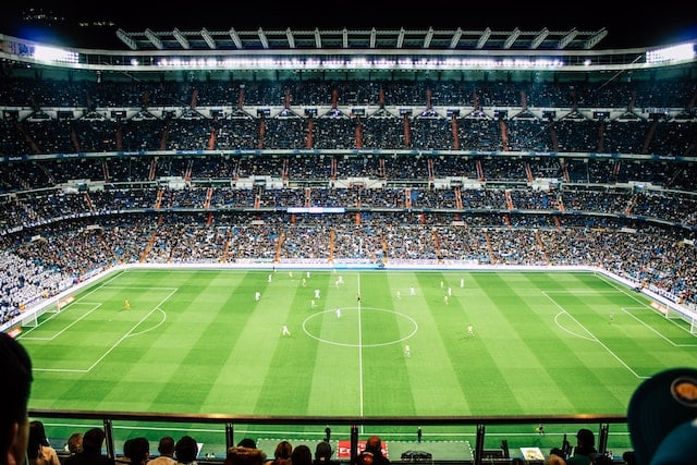 A stadium full of fans during football match, Sports Advertising Agency.