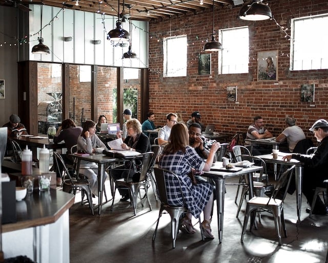 People drinking coffee at coffee shop, Beverage Advertising Agency